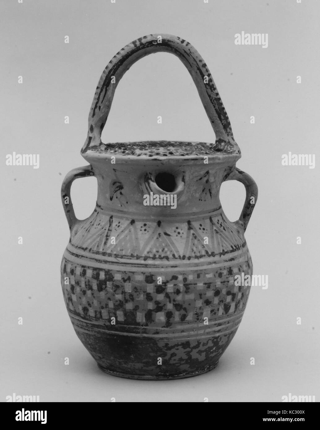 Terracotta vase with strainer, spout, and three handles, late 8th–early 7th century B.C Stock Photo