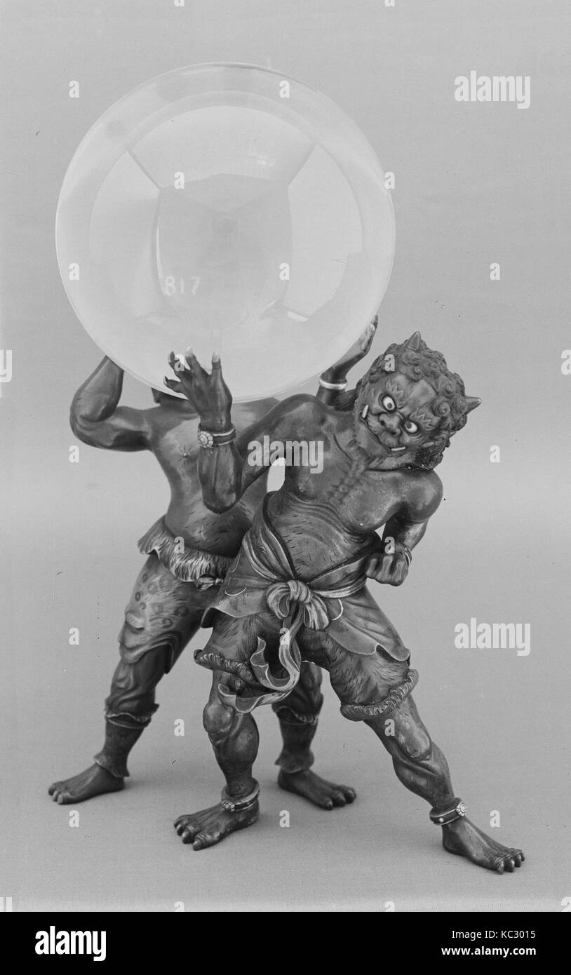 Crystal Ball on a Bronze Stand composed of Two Demons, 18th century Stock Photo