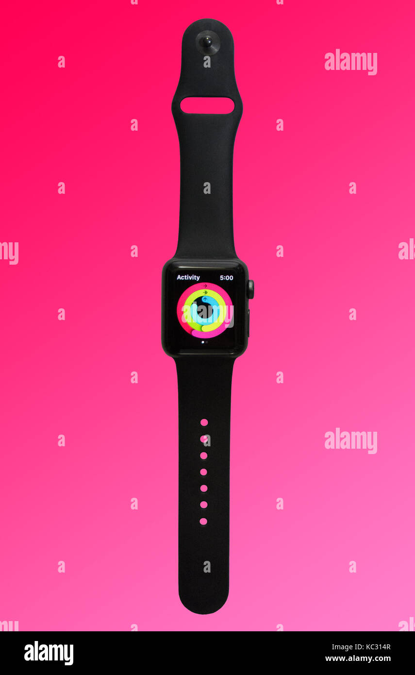 Apple Watch Series 2 (38mm with Space Gray Aluminum with Black Sport Band) showing the colorful rings of the Activity fitness tracker app. Stock Photo