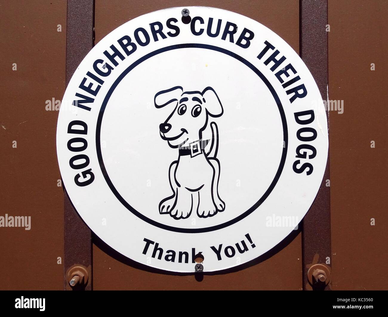 A sign requesting  the need to keep your dog under control in this environment Stock Photo