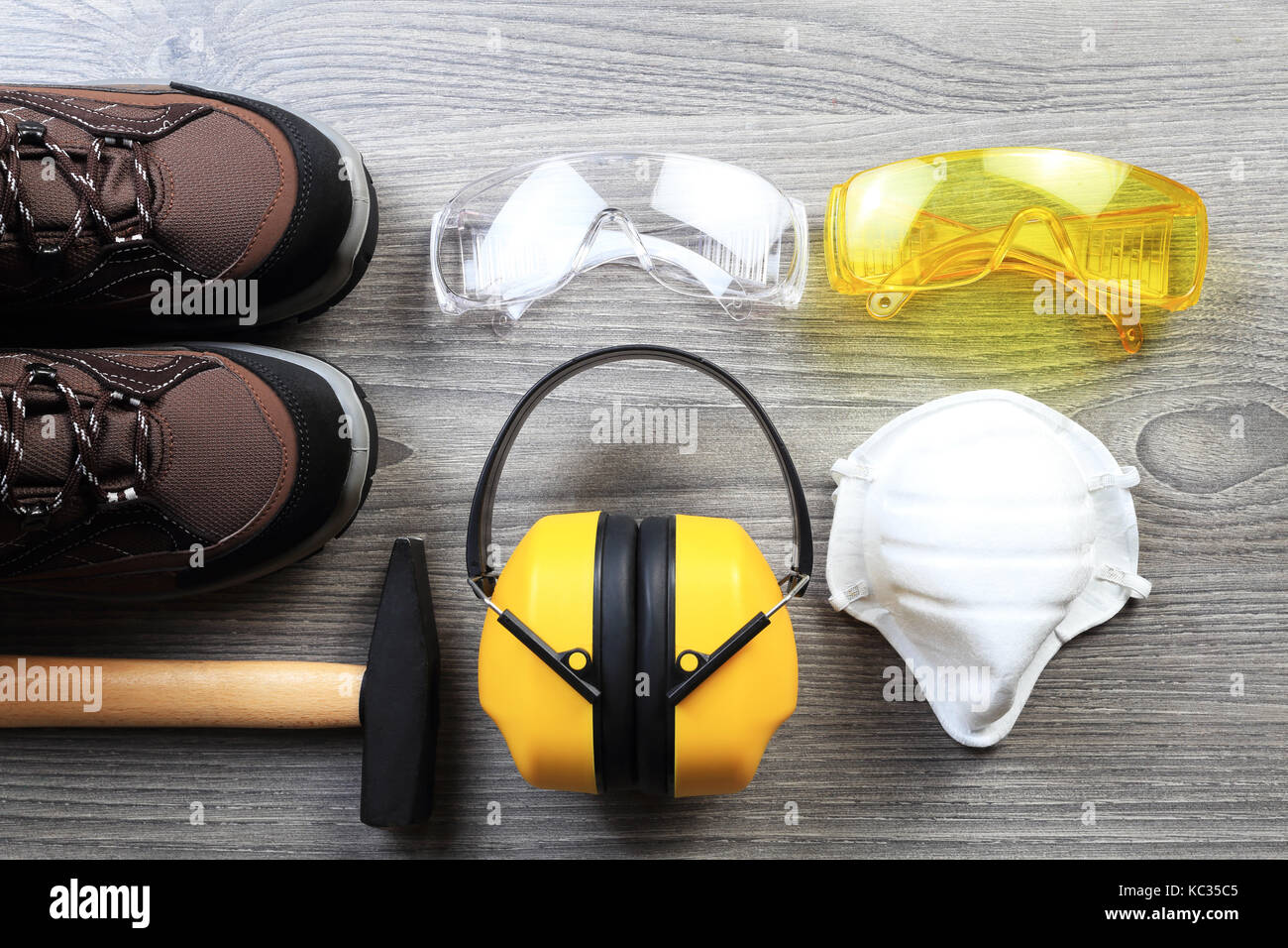 Working protective wear and accessories. New constructor glasses and headphones from above. Working devices from above. Stock Photo