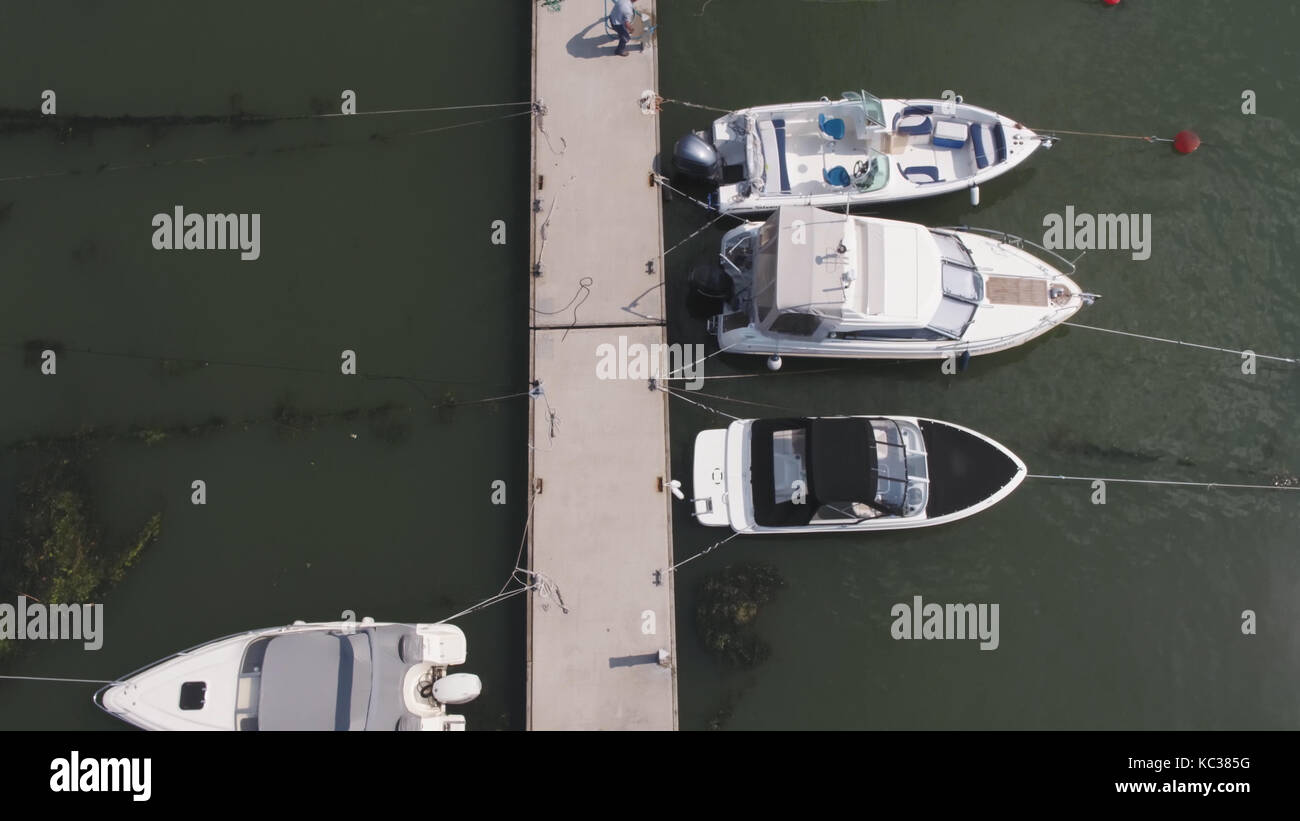 Sailboats moored in the port, a lot of beautiful yachts. Top view on ...