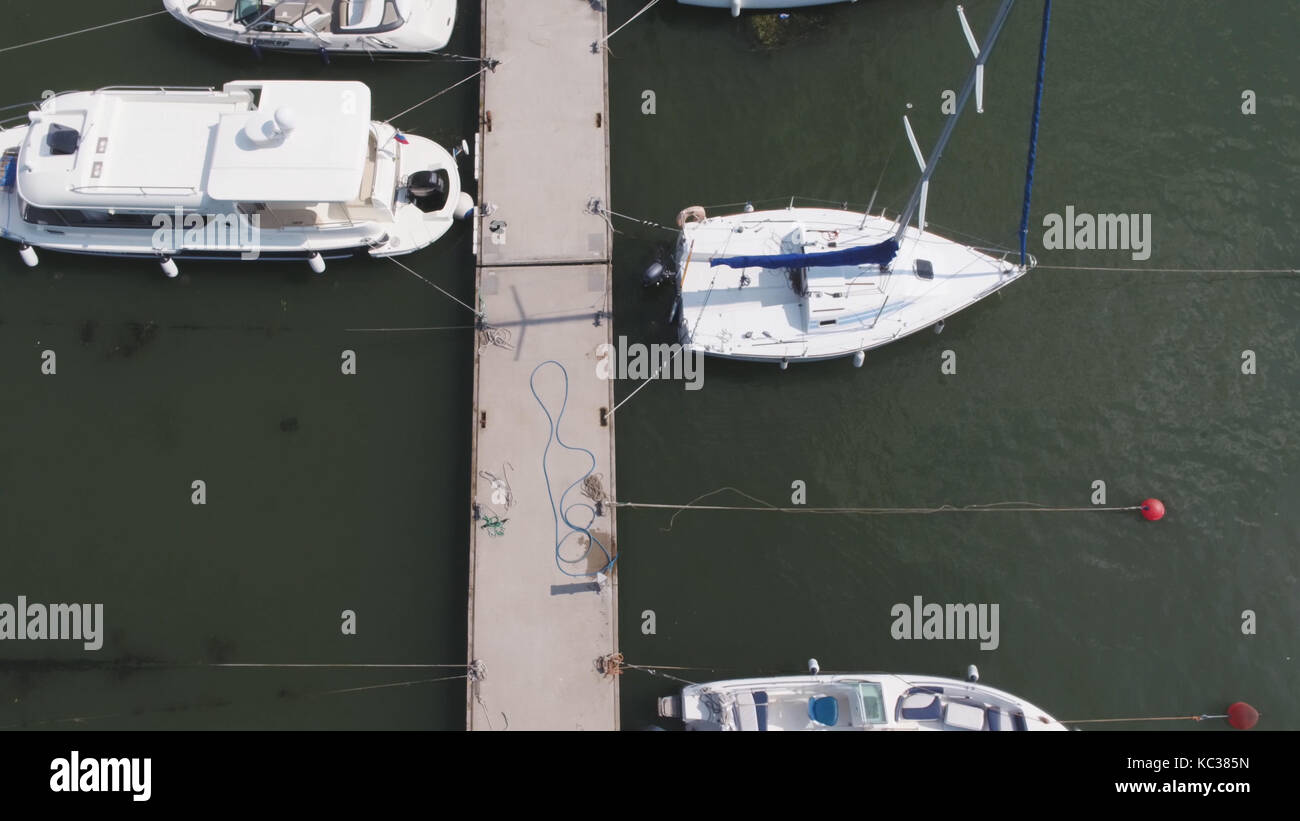 Sailboats moored in the port, a lot of beautiful yachts. Top view on ...