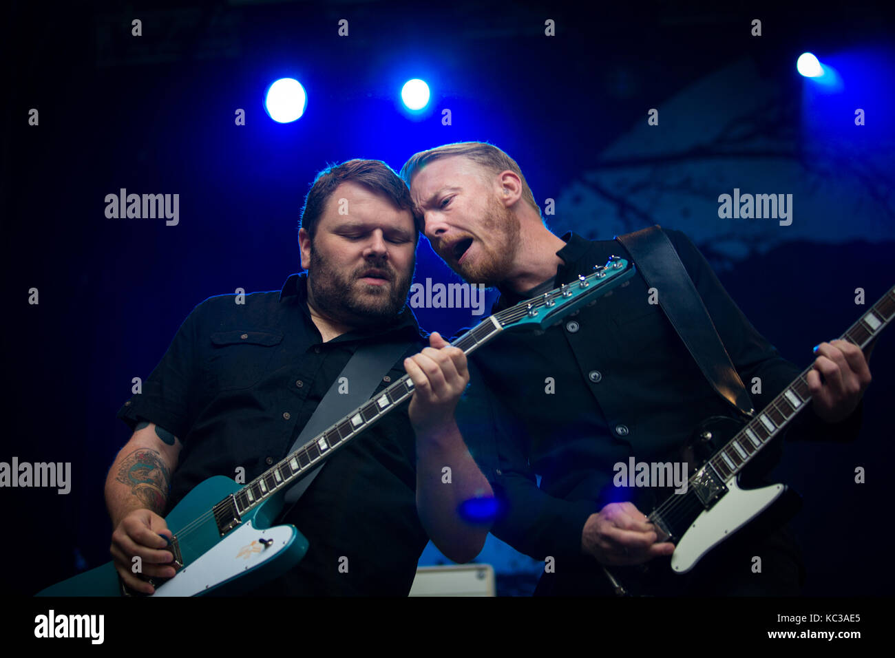 The Norwegian hard rock band Skambankt performs a live concert at the Norwegian music festival Bergenfest 2014. Here vocalist and guitarist Terje Winterstø Røthing is pictured live on stage with guitarist Hanz Panzer. Norway, 11/06 2014. Stock Photo