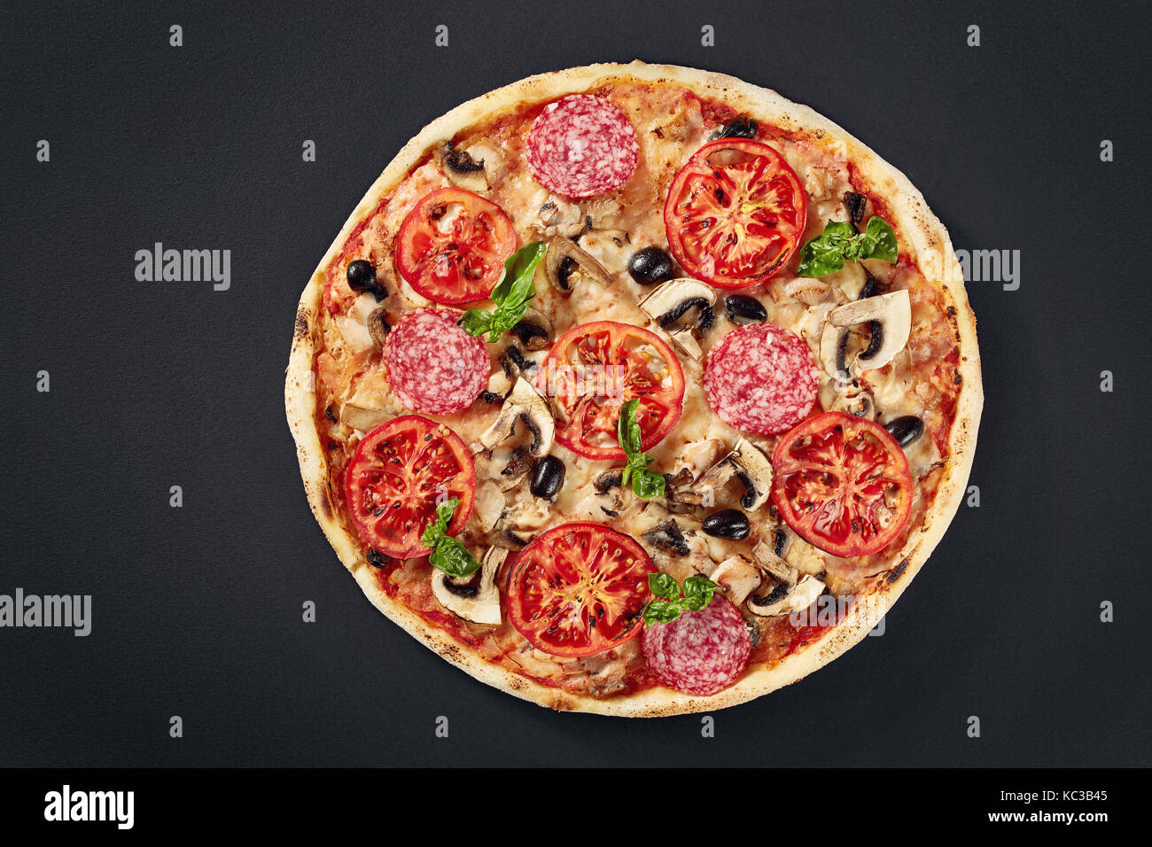 Raw pizza dough with ingredients for cooking vegetarian pizza on the