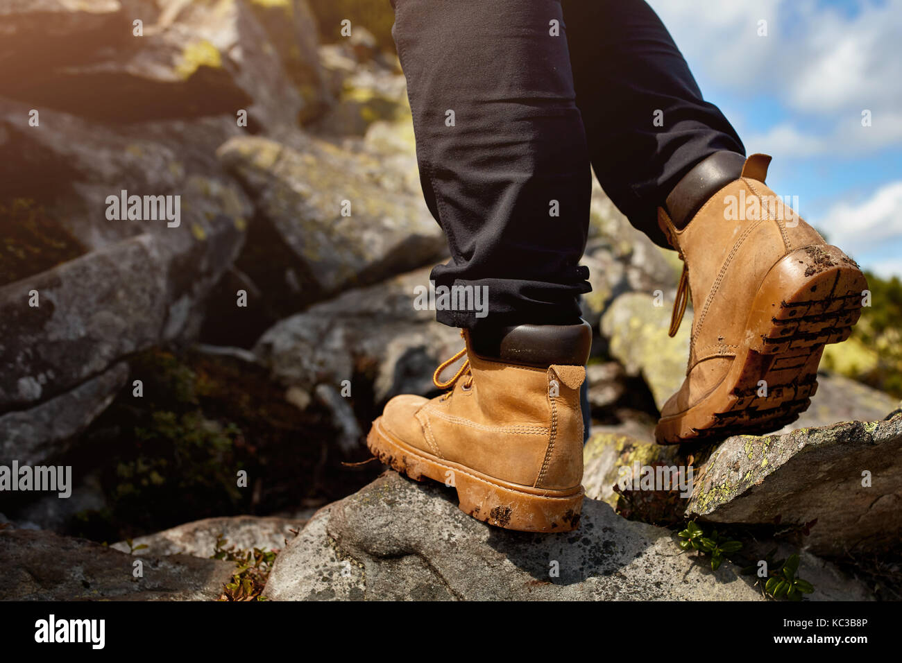 hiking boots on the rock in the mountains Stock Photo Alamy