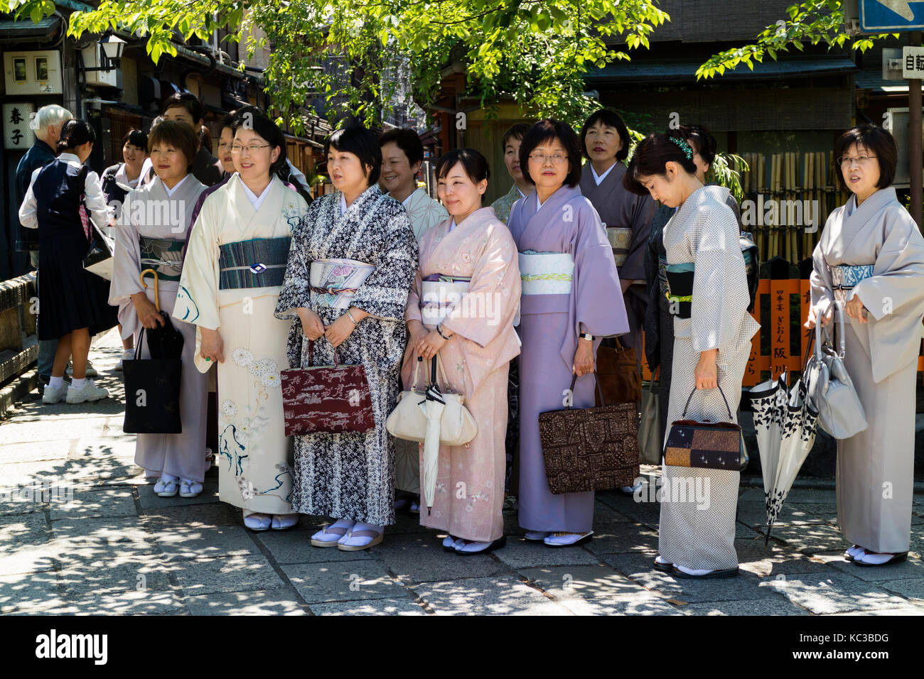 Kyoto, Japan - May 18, 2017: Group of women in kimono on a trip in Kyoto are posing for a picture Stock Photo