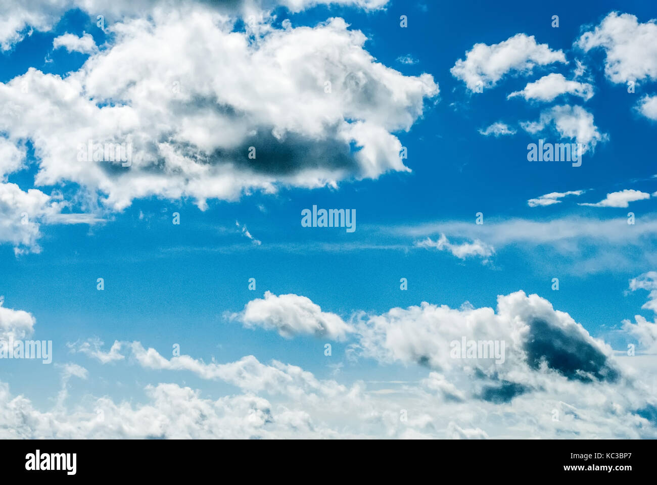 Blue sky with many white clouds. Photo with noise Stock Photo - Alamy