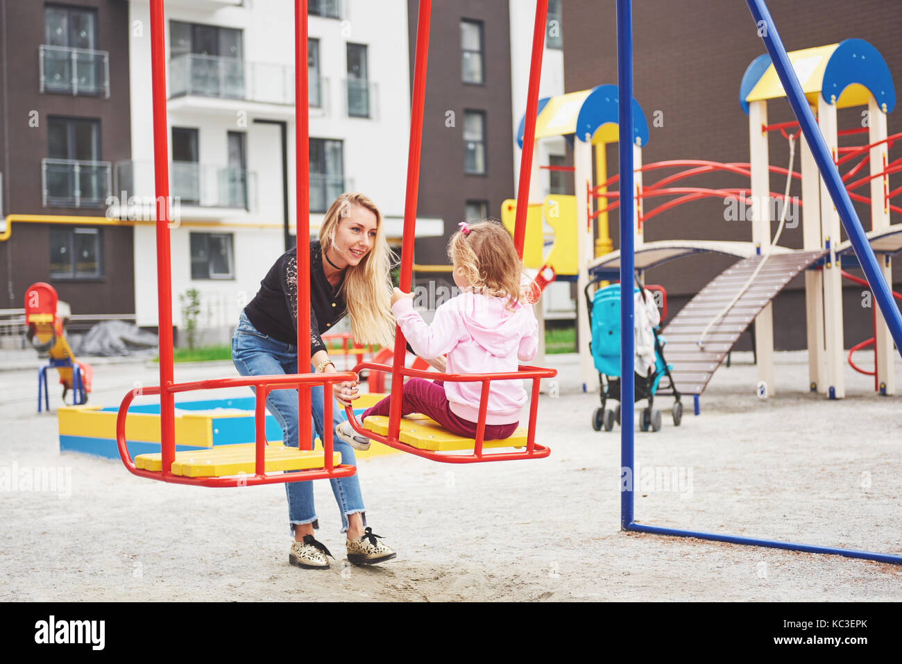 mother with child on the playground Stock Photo