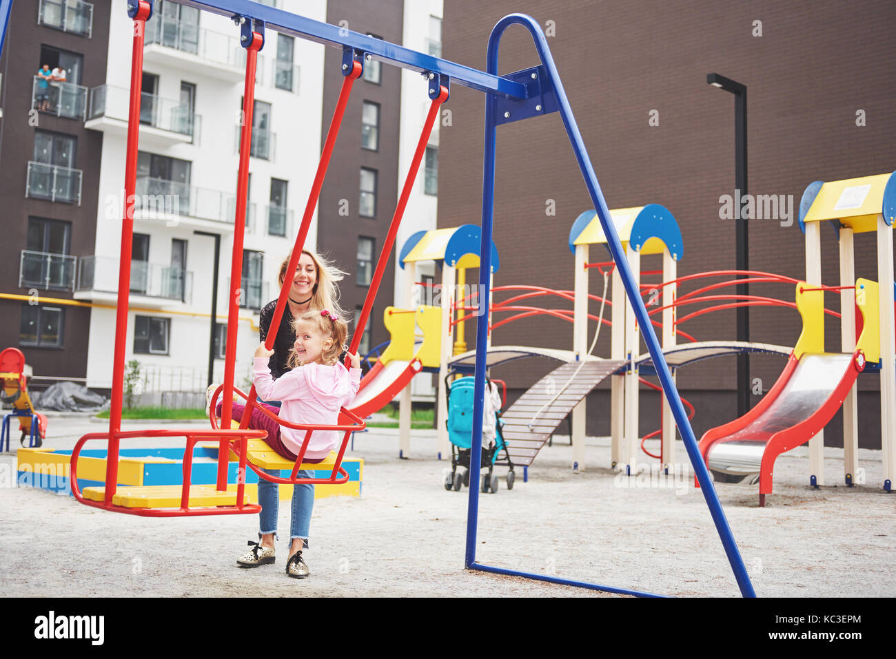 mother with child on the playground Stock Photo