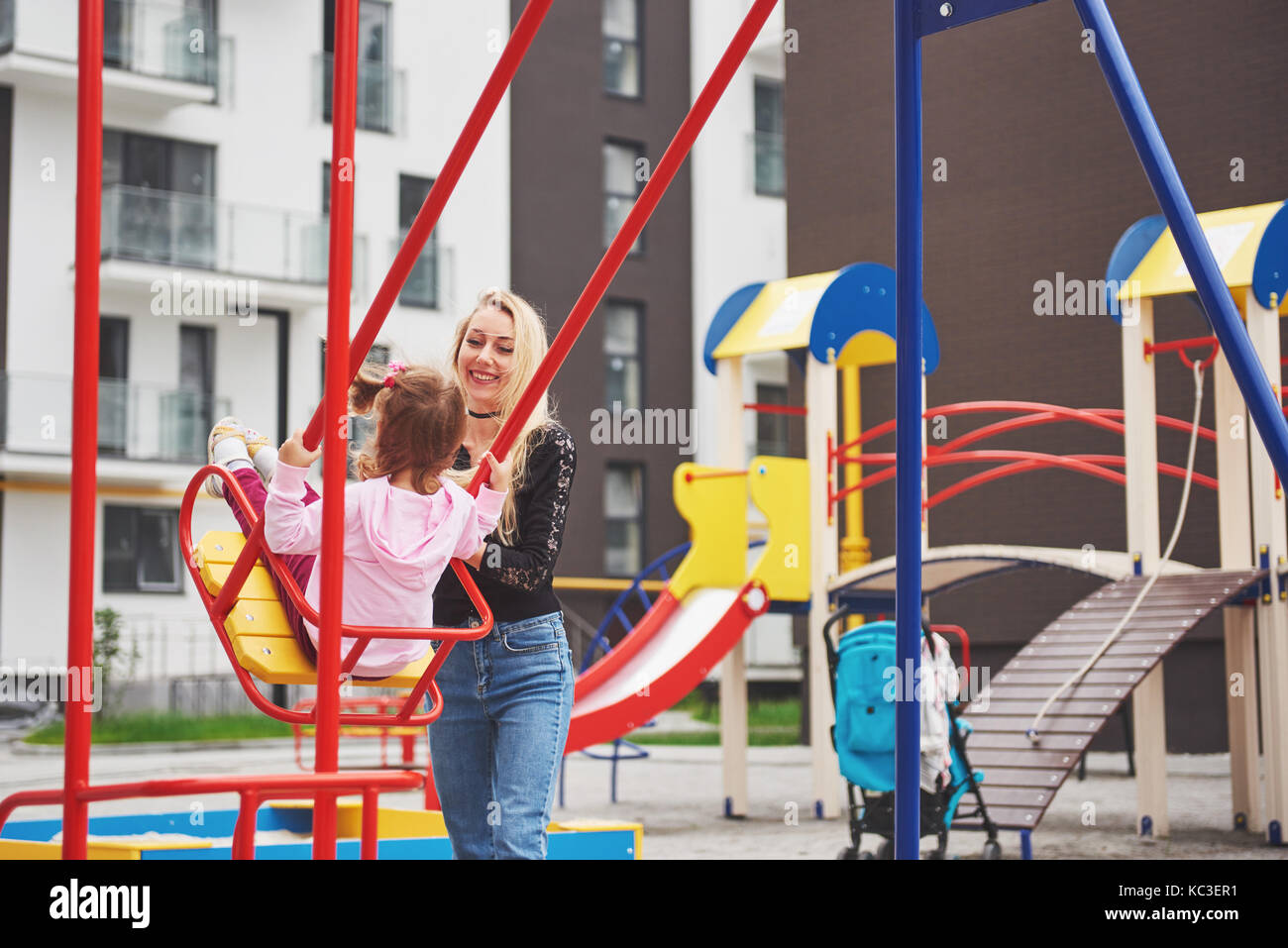 mother with child on the playground Stock Photo