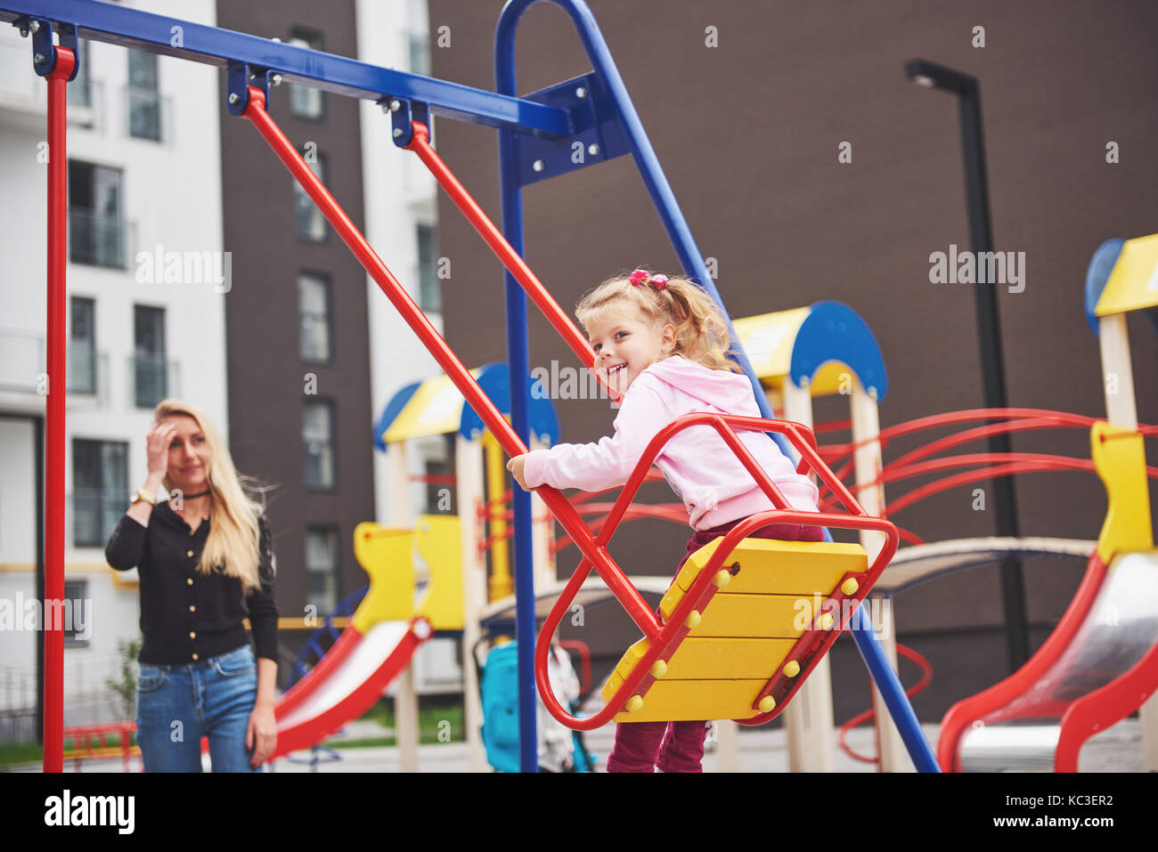 mother with child on the playground Stock Photo