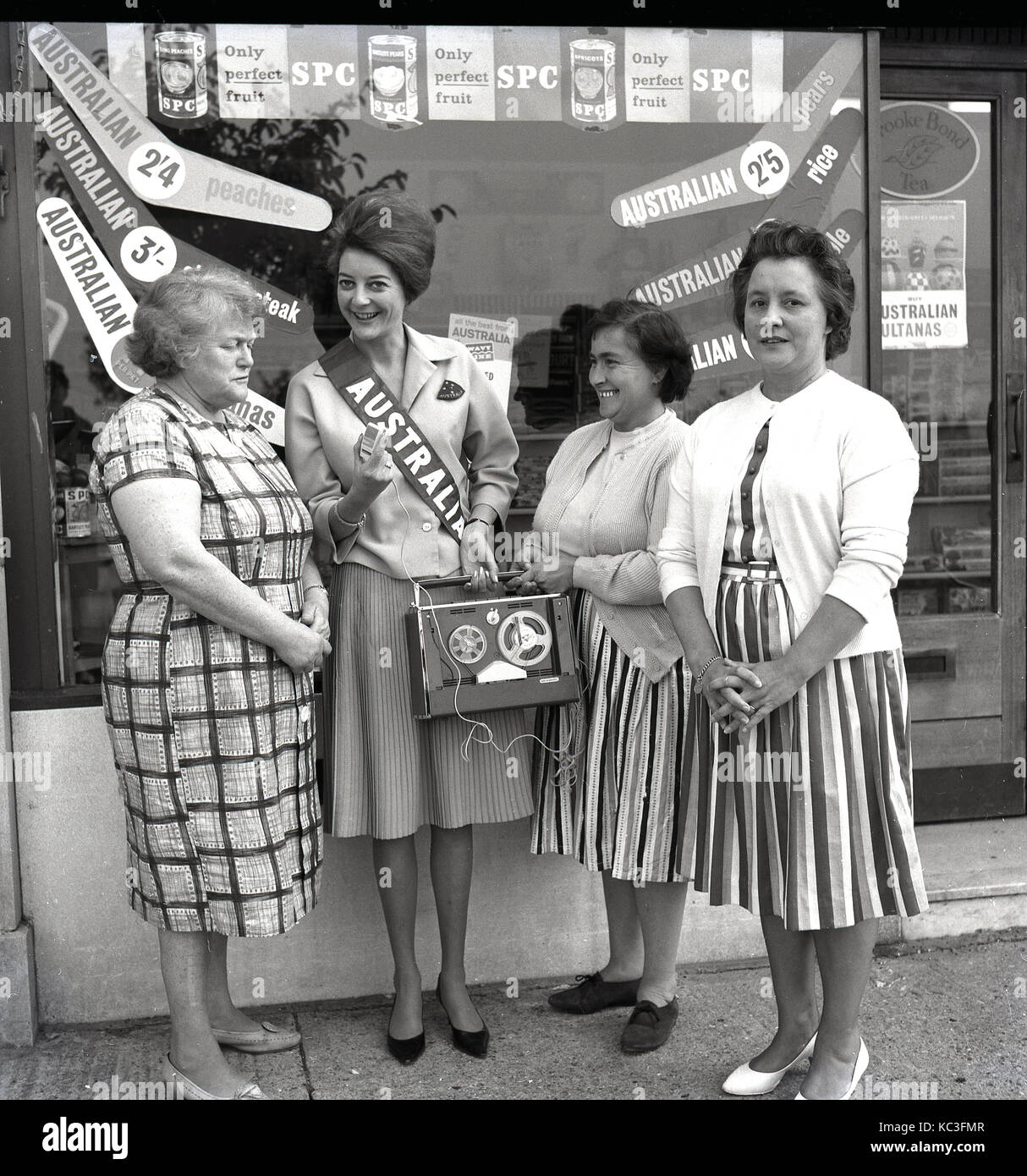 1960s, historical, promotional lady from the Australian canned fruit company, SPC, talking to local female consumers about their products and recording their comments on a reel-to-reel tape recorder, Aylesbury, Bucks, England, UK. Stock Photo