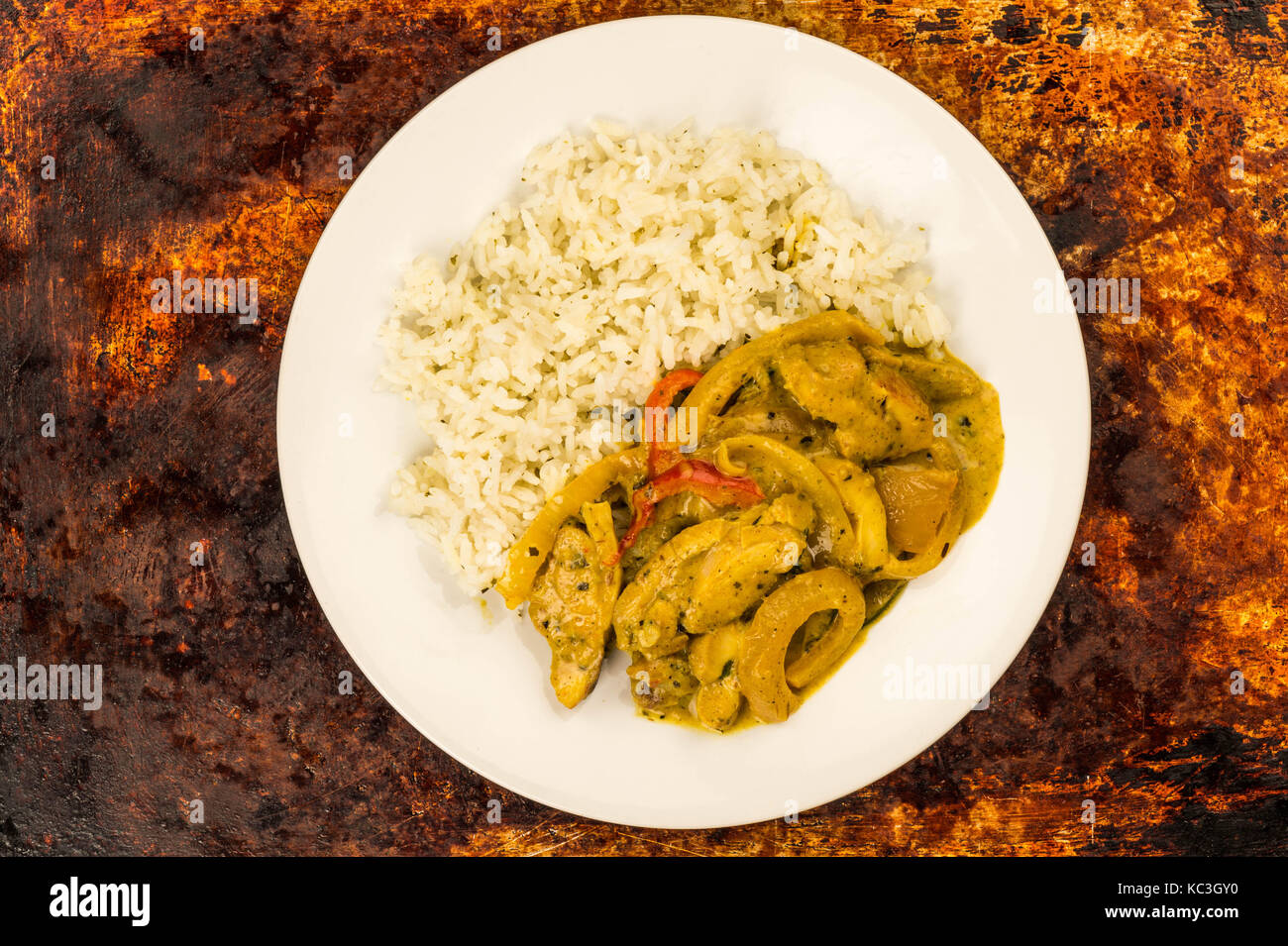 Thai Style Chicken Panang Curry With Jasmine Rice Against a Distressed ...