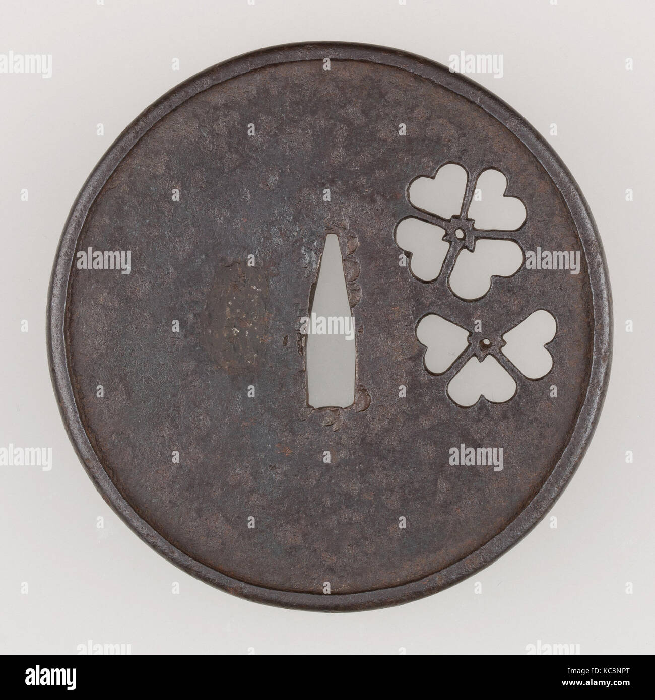 Sword Guard (Tsuba), late 14th–early 15th century, Japanese, Iron, copper, H. 3 3/4 in. (9.5 cm); W. 3 11/16 in. (9.4 cm Stock Photo