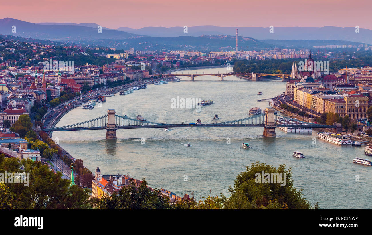 Budapest, Hungary - Panoramic skyline view at sunset of the famous Szechenyi Chain Bridge, Margaret Bridge, Margaret Island and Parliament of Hungary  Stock Photo