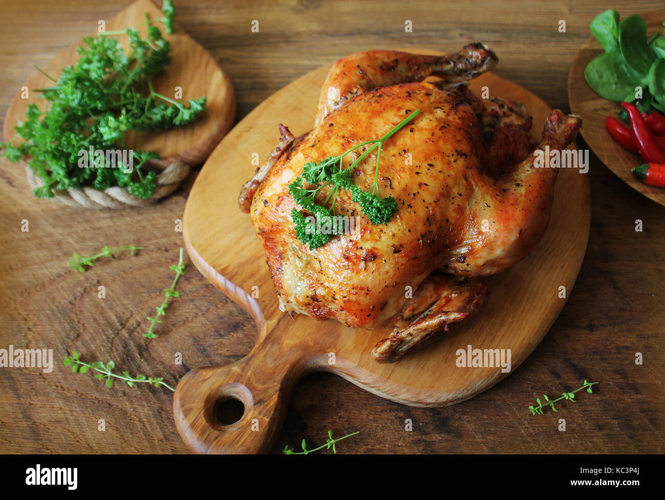 Whole roasted chicken on cutting board Stock Photo Alamy