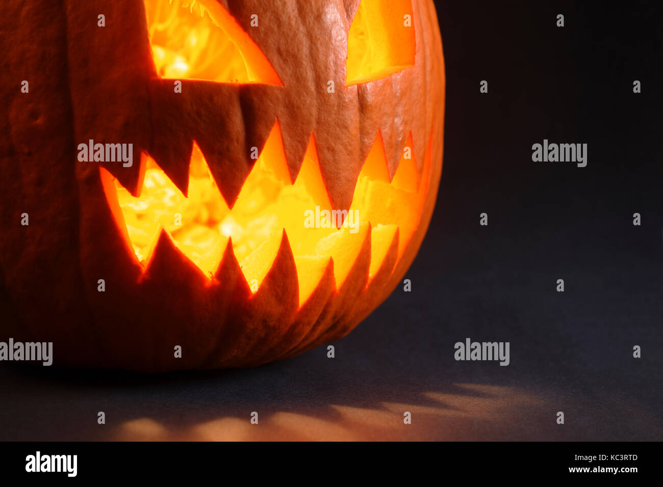 Photo of an angry pumpkin illuminated by a candle inside Stock Photo Alamy