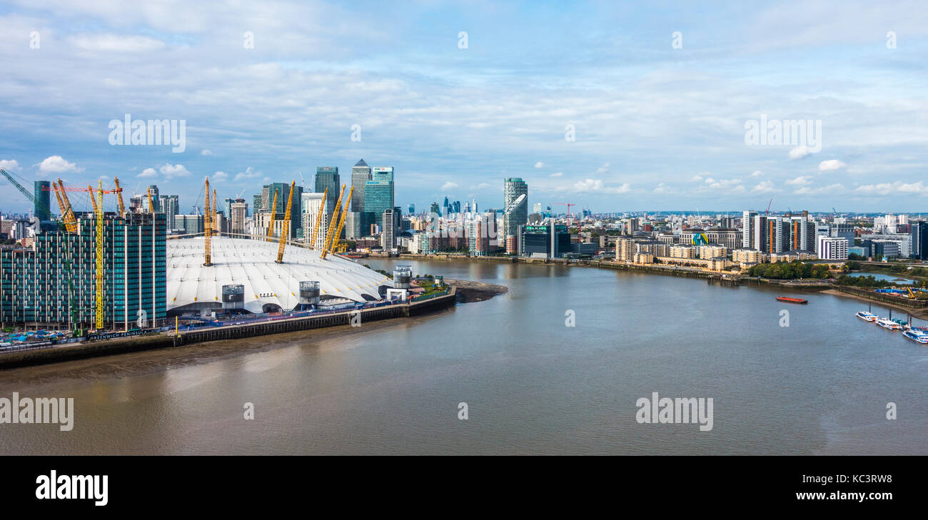 Greenwich Peninsular apartments development, with the 02 Arena and iconic city skyscraper buildings and Docklands behind. SE London, England, UK. Stock Photo