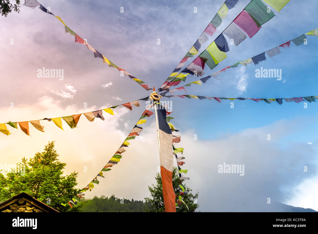 Buddhist tibetan prayer flags against blue sky Stock Photo