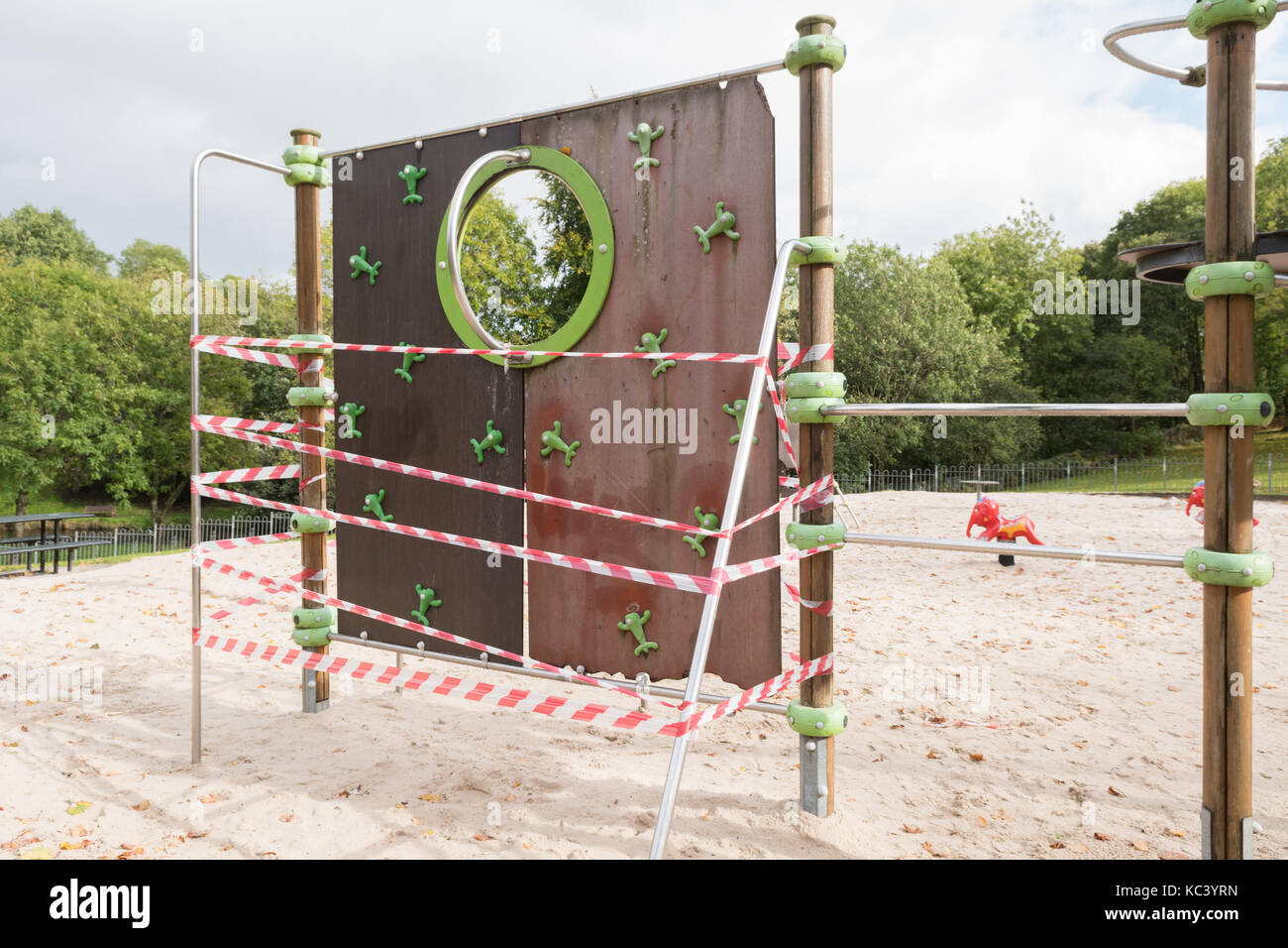 taped off broken unsafe play equipment Stock Photo
