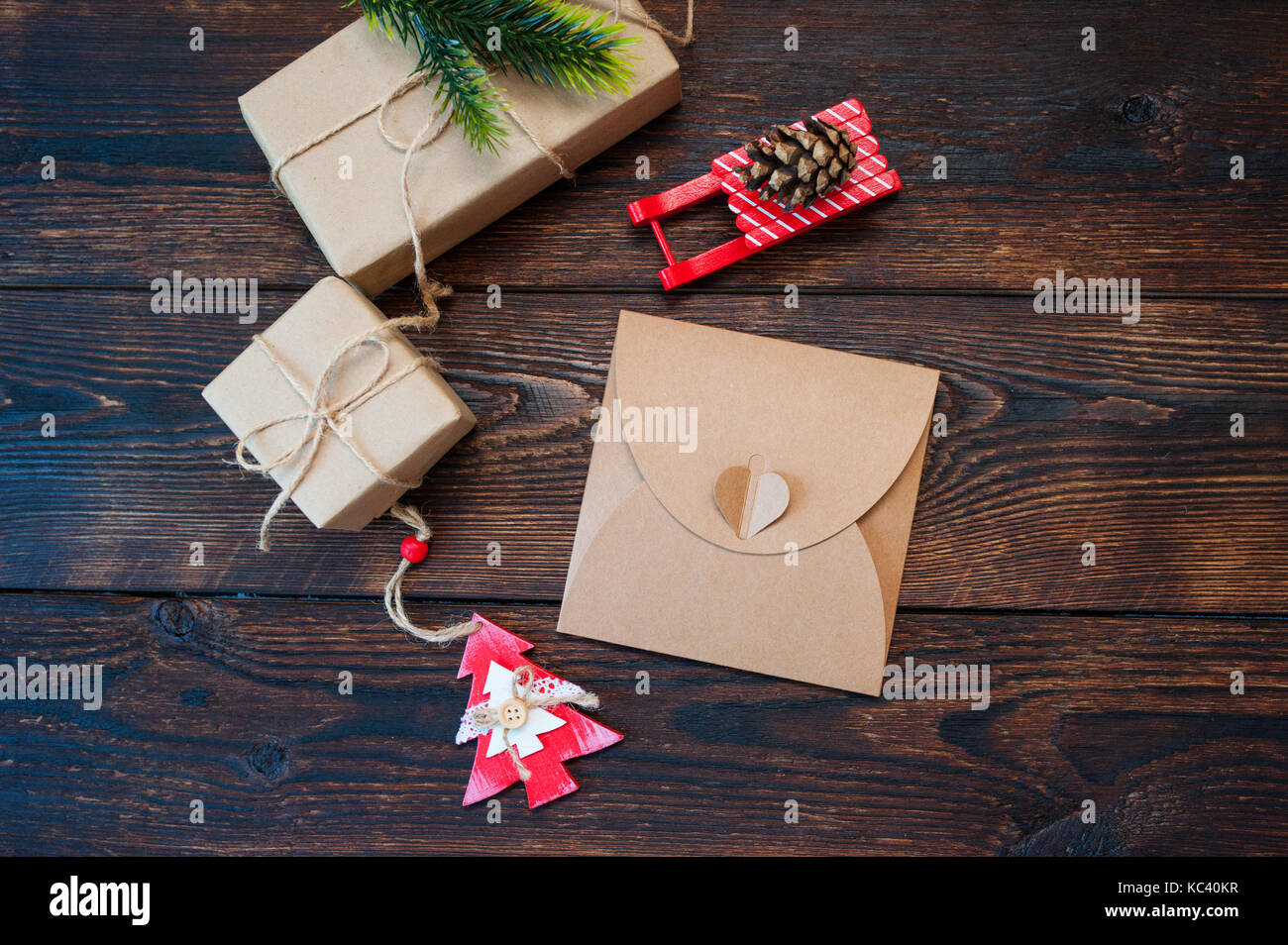 Mokcup Christmas composition of gift boxes and wooden toys on a background and place for text Stock Photo