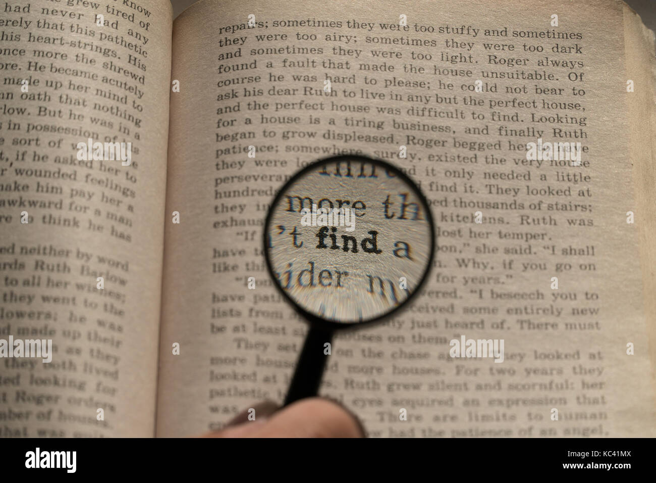 View through loupe at book. Word find Stock Photo Alamy
