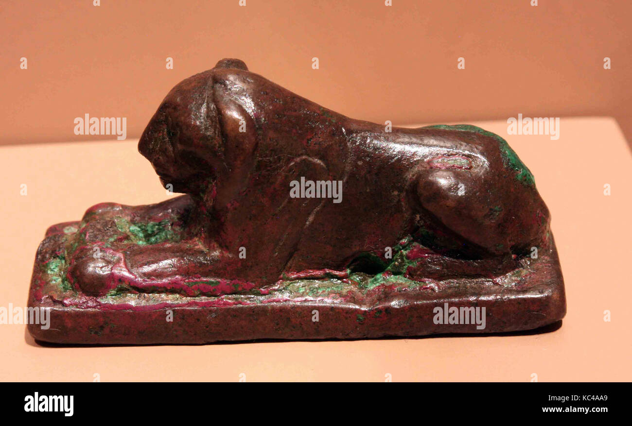 Figurine of a Recumbent Lion, Late Period, 664–332 B.C., From Egypt, Copper alloy, H. 2.3 cm (7/8 in); l. 6 cm (2 3/8 in Stock Photo