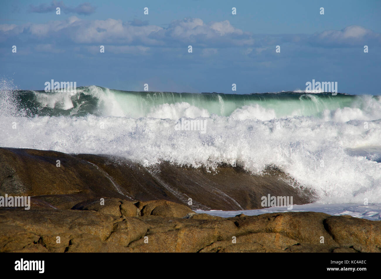 Curling waves crashing onto the rocks in South Africa Stock Photo Alamy