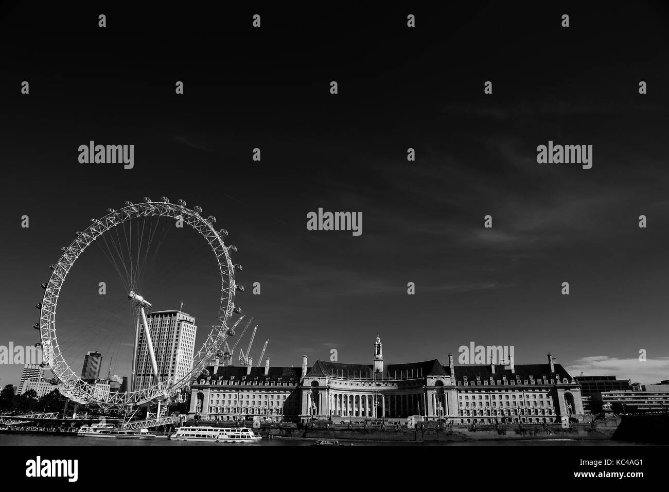 black and white image of the London eye in summer time Stock Photo