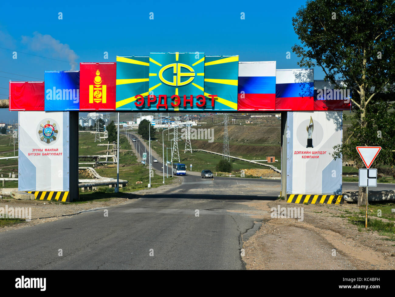Main gate with the Mongolian and Russian flags to the Mongolian-Russian joint venture Erdenet Mining Corporation EMC, Erdenet, Mongolia Stock Photo