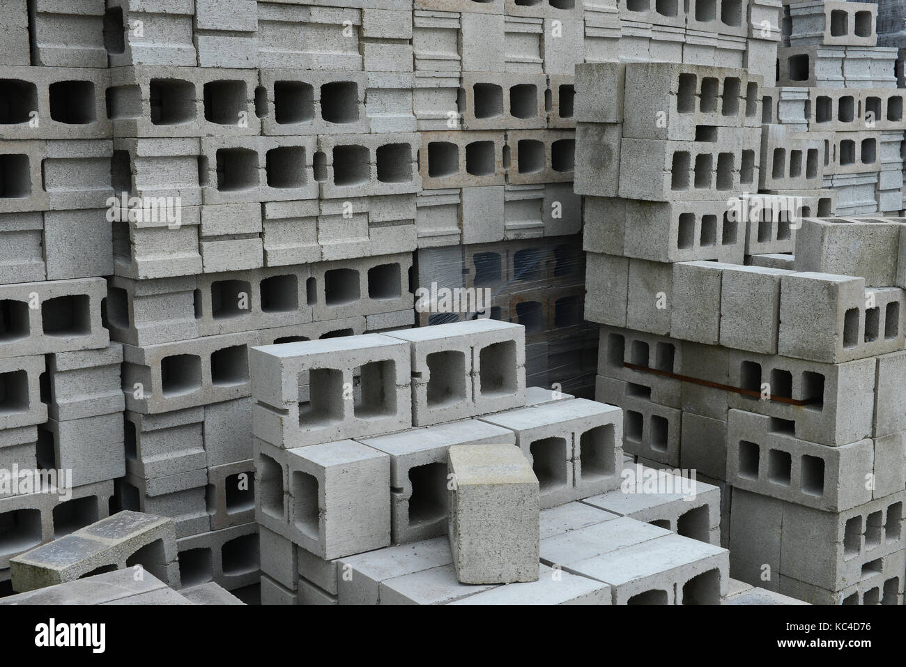 A pile of concrete building blocks in a materials yard. Stock Photo