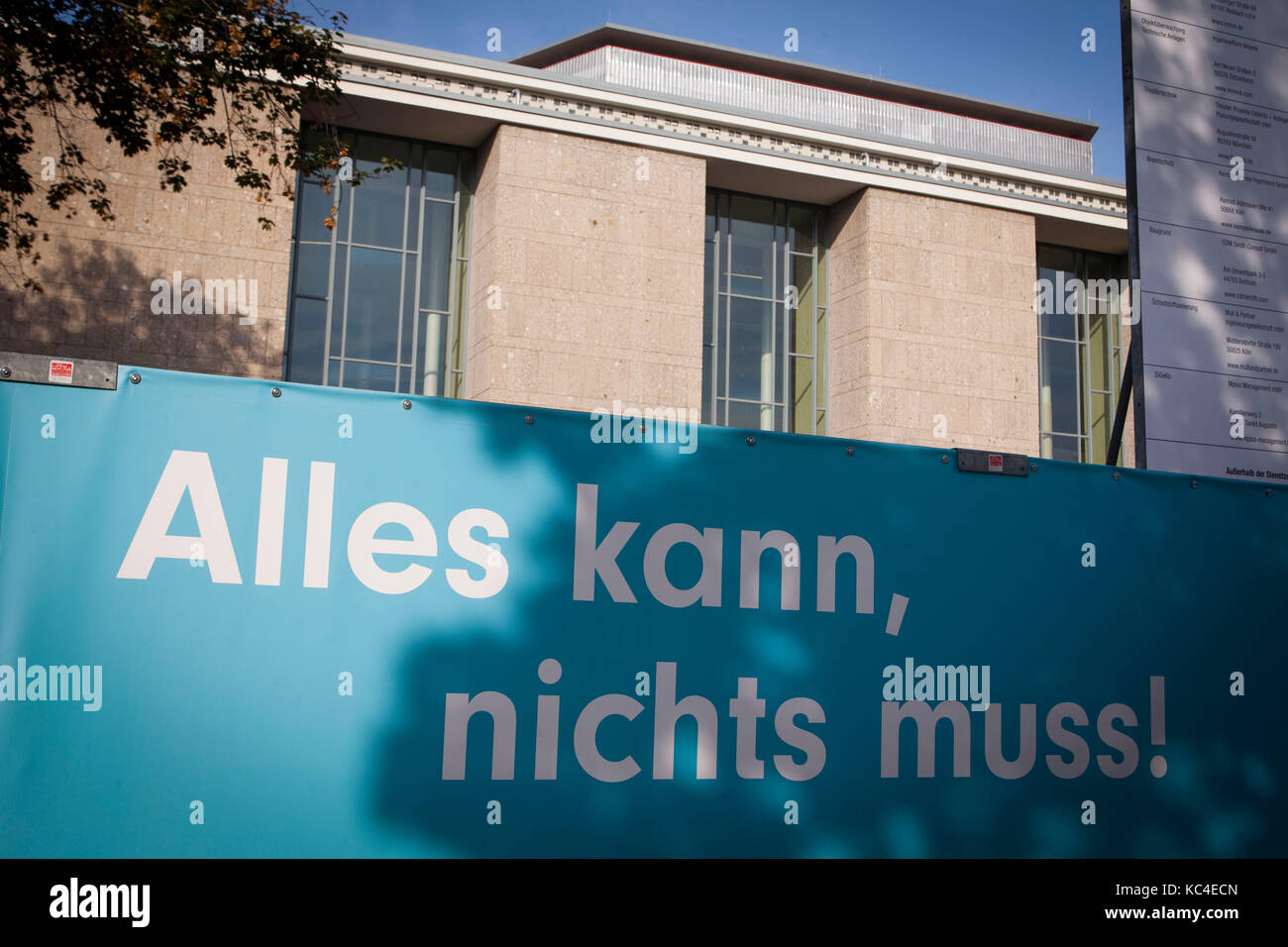 Germany, Cologne, hoarding at the opera house at the Offenbach square, restoration (translation: everything is possible, nothing has to be).  Deutschl Stock Photo