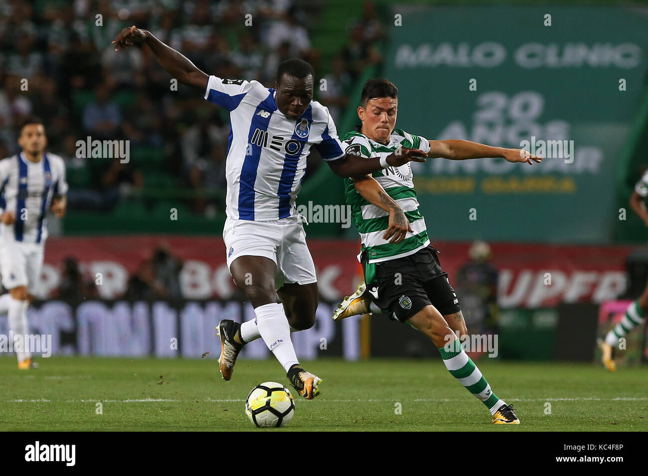 Lisbon, Portugal. 01st Oct, 2017. FC PortoÕs forward Vincent Aboubakar from Cameroon (L) and Sporting«s defender Jonathan Silva from Argentina (R) during Premier League 2017/18 match between Sporting CP and FC Porto, at Alvalade Stadium in Lisbon on October 1, 2017. (Photo by Bruno Barros / DPI) Credit: Bruno Barros/Alamy Live News Stock Photo