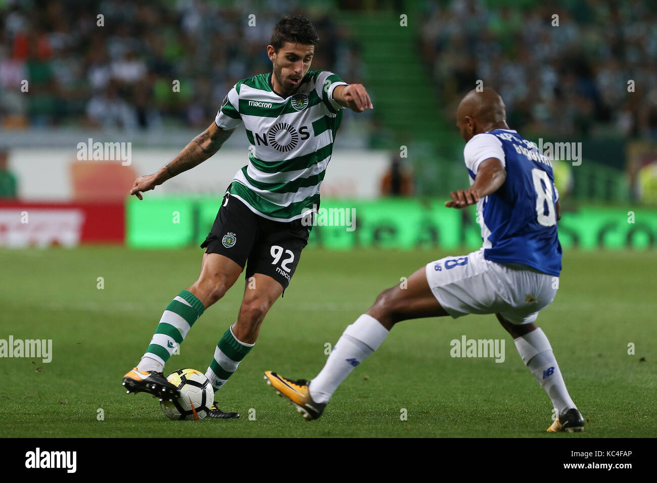 Lisbon, Portugal. 01st Oct, 2017. Sporting«s defender Cristiano Piccini from Italy (L) and FC PortoÕs forward Yacine Brahimi from Algeria (R) during Premier League 2017/18 match between Sporting CP and FC Porto, at Alvalade Stadium in Lisbon on October 1, 2017. (Photo by Bruno Barros / DPI) Credit: Bruno Barros/Alamy Live News Stock Photo