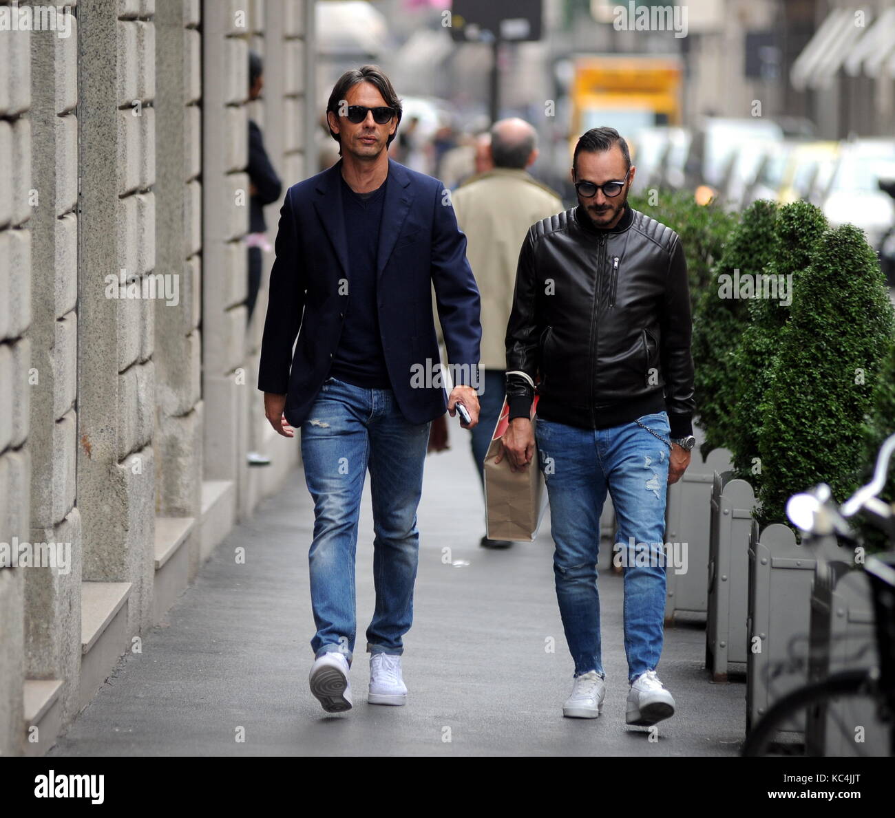 Milan, Filippo Inzaghi walking in the center with a friend Filippo 'Pippo' Inzaghi, former AC Milan and national football player, now trains VENICE in Serie B. He is surprised to walk in the center together with a friend. Stock Photo