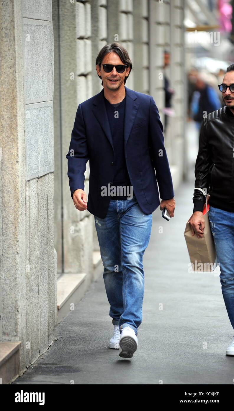 Milan, Filippo Inzaghi walking in the center with a friend Filippo "Pippo" Inzaghi, former AC Milan and national football player, now trains VENICE in Serie B. He is surprised to walk in the center together with a friend. Stock Photo