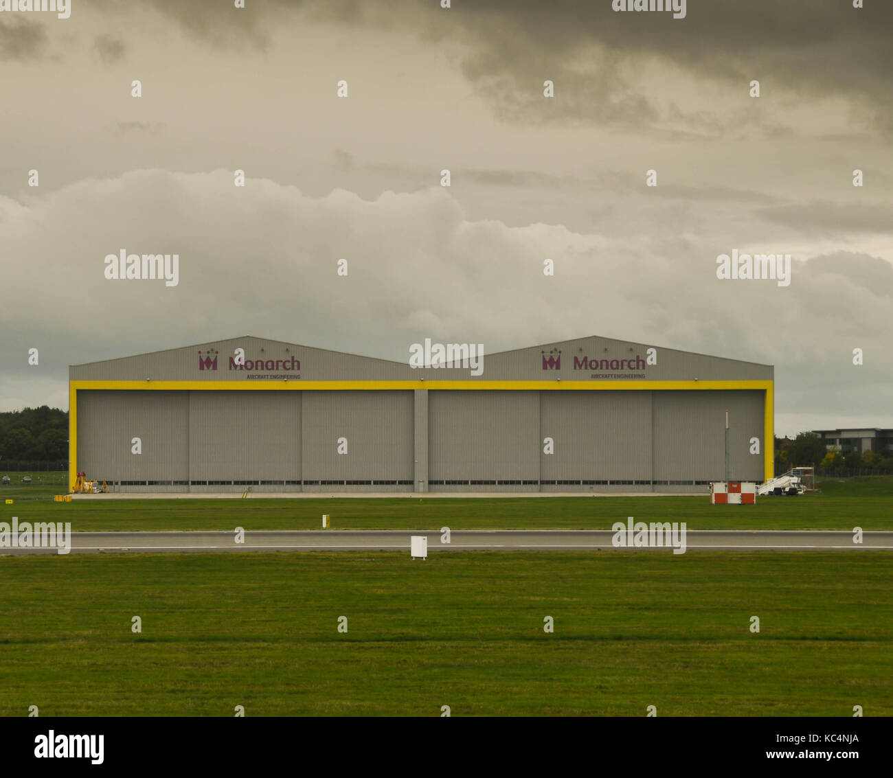 Birmingham, UK. 02nd Oct, 2017. The doors on Monarch Airlines' maintenance hangar at Birmingham Airport remain firmly shut on the afternoon of the day of its collapse; with ominous dark clouds overhead Credit: Ceri Breeze/Alamy Live News Stock Photo