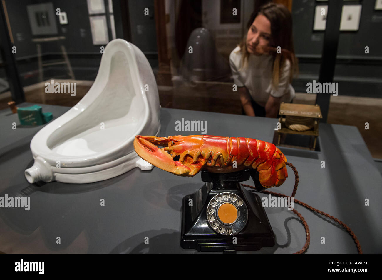 London, UK. 03rd Oct, 2017. Marcel Duchamp’s Fountain, 1917/1964 and Salvador Dalí’s Lobster Telephone, 1938 - Dalí/Duchamp at the Royal Academy of Arts. It is the first exhibition to present the art of these famous artists in dialogue. Marcel Duchamp (1887–1968) and Salvador Dalí (1904–1989) are usually seen as opposites in almost every respect, yet they shared attitudes to art and life that are manifested in their respective oeuvres on many levels. Dalí / Duchamp runs at the Royal Academy of Arts from 7 October 2017 – 3 January 2018. Credit: Guy Bell/Alamy Live News Stock Photo