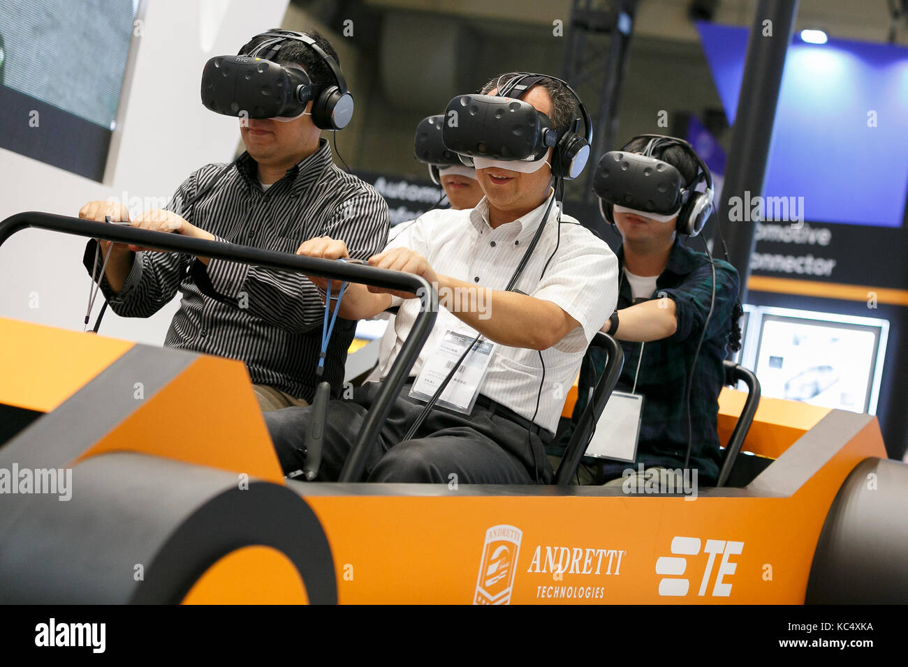 Japanese Virtual Racing Chba, Japan. 3rd Oct, 2017. Visitors enjoy a car race video game using ...