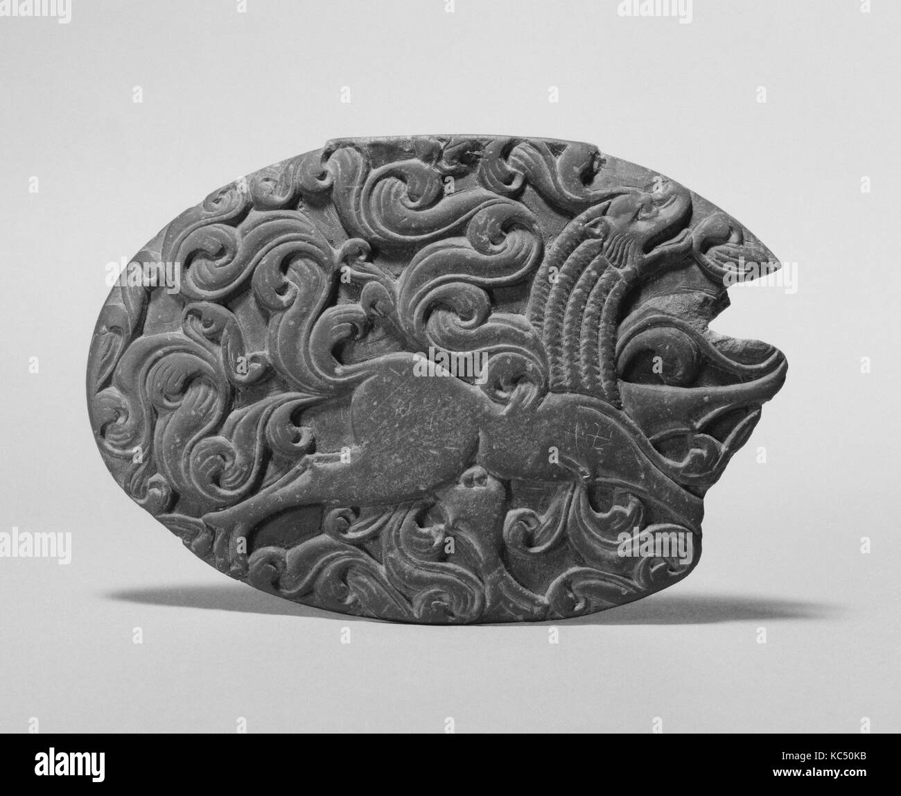 Box Lid with a Winged Lion and Remnant of an Iron Hinge, ca. 5th century Stock Photo