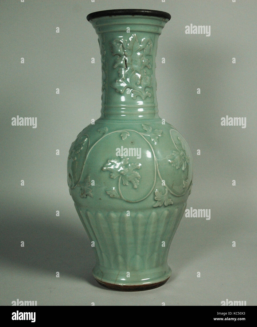 Vase with Peony Scrolls, Yuan dynasty (1271–1368), mid-14th century, China, Porcelain with molded decoration under celadon Stock Photo