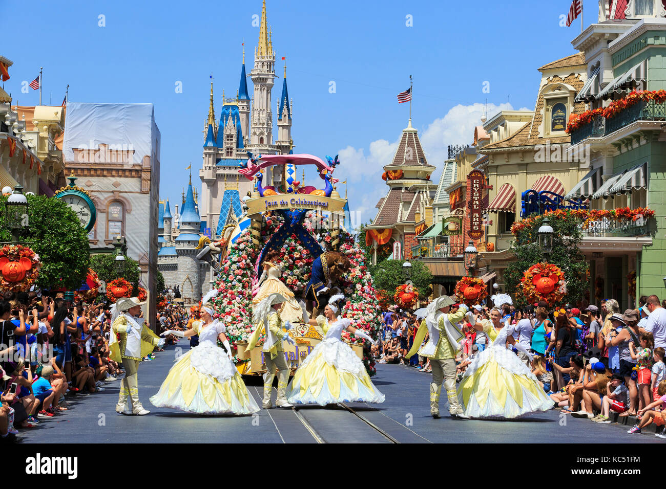 Walt Disney's Magic Kingdom theme park, showing the fairytale castle, Orlando, Florida, USA and the fairytale parade 'Carnival of Fantasy' Stock Photo