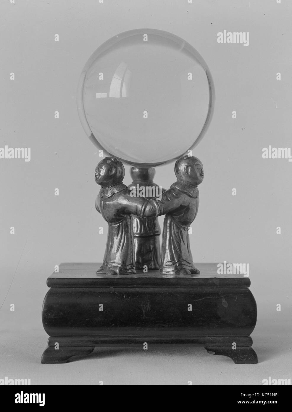 Crystal Ball on a Silver Stand composed of Three Figures, 18th century Stock Photo