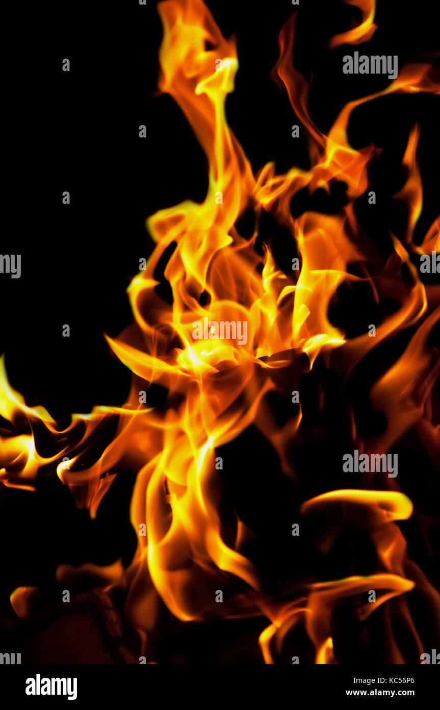 The yellow flame fire on a black isolated background Stock Photo Alamy
