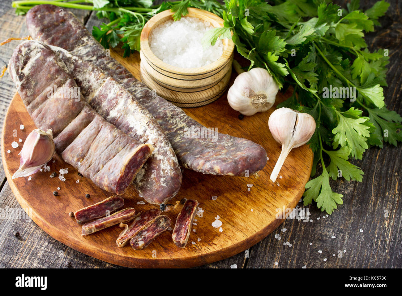 Beef jerky smoked sausage sudzhuk with spices and garlic is served on a