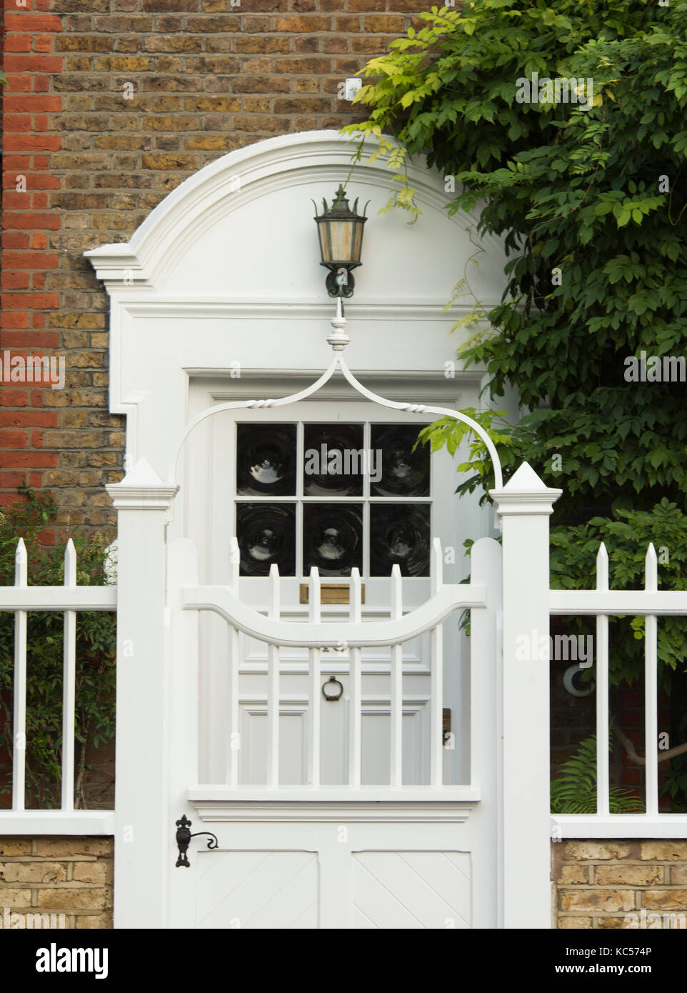 A wooden gate and stylish door in Queen Anne’s Gardens in Bedford Park