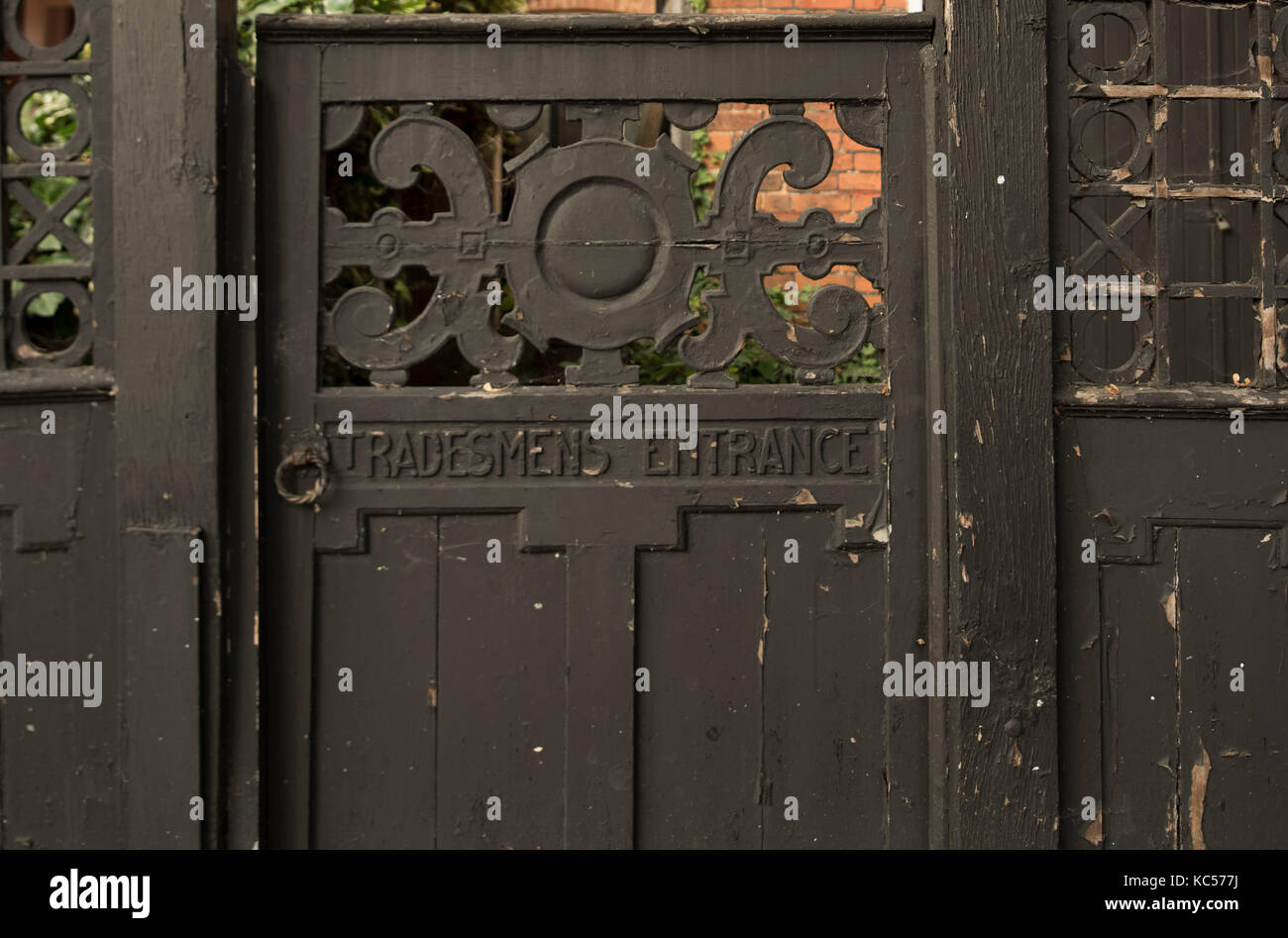An old ‘Tradesmens Entrance’ gate on Blenheim Road in Bedford Park, Chiswick, London, UK Stock Photo