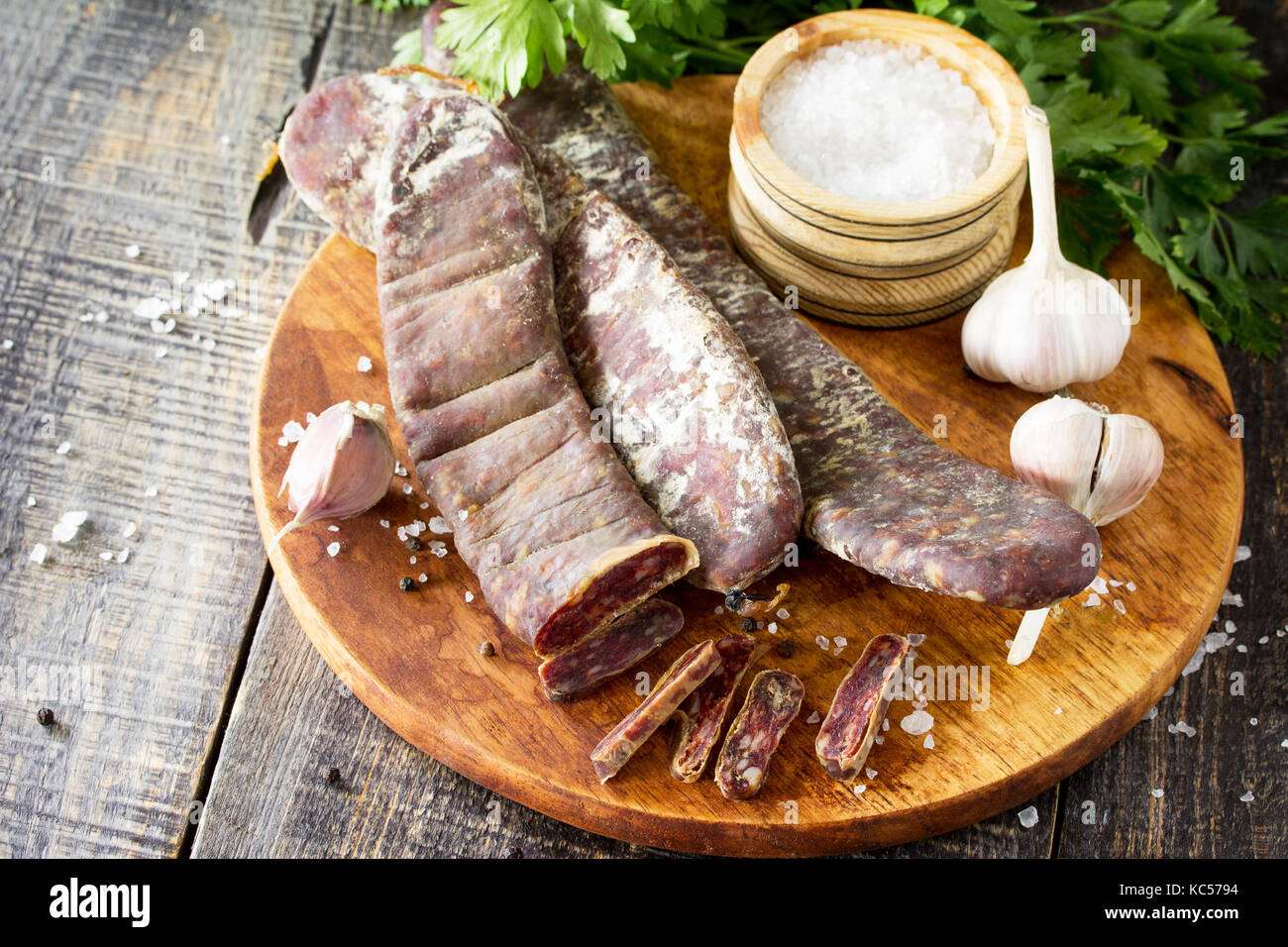 Beef jerky smoked sausage sudzhuk with spices and garlic is served on a