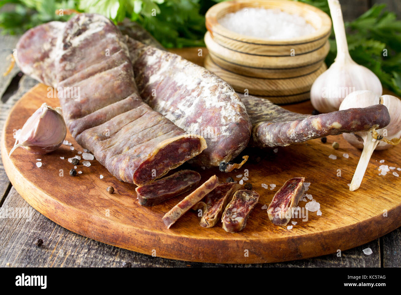Beef jerky smoked sausage sudzhuk with spices and garlic is served on a